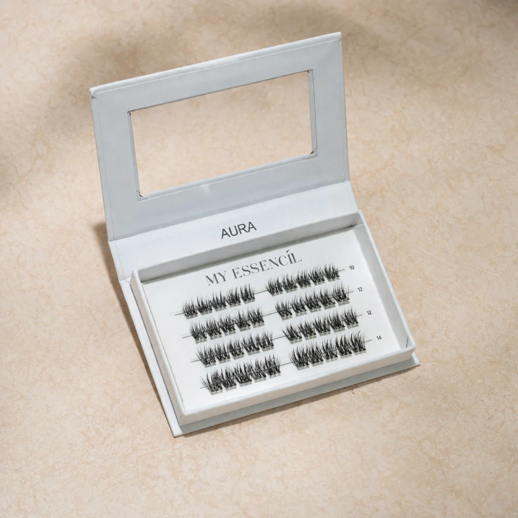 Coffret AURA MyEssencìl fermé avec fenêtre transparente sur fond beige