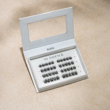 Coffret AURA MyEssencìl fermé avec fenêtre transparente sur fond beige